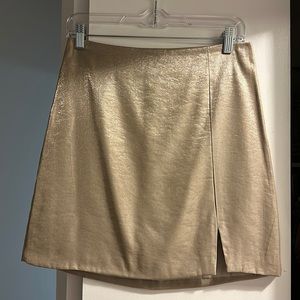 Gold miniskirt with slit